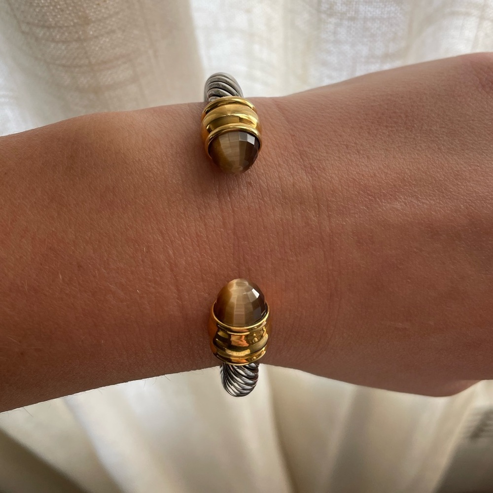 Famous designer inspired bracelet.  Silver and gold with brown gems. Adjustable.